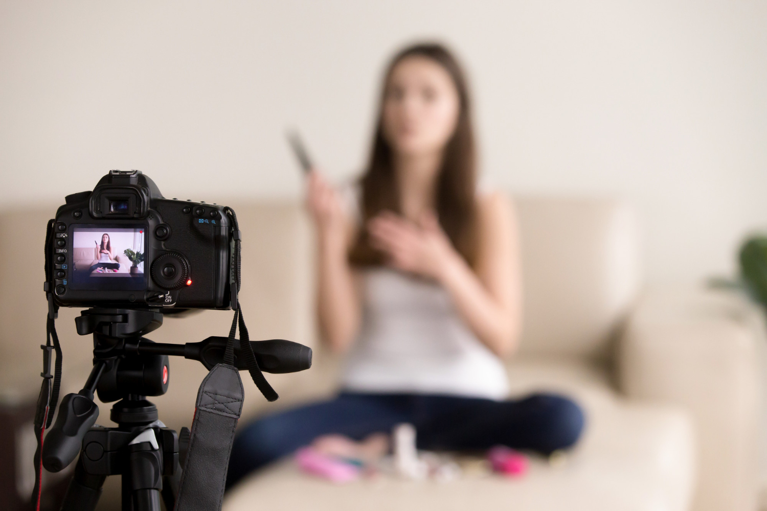 young-female-videoblogger-recording-prod